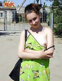 18 y.o. cutie hikes up her green dress to reveal her pussy and lowers it down showing her boobs